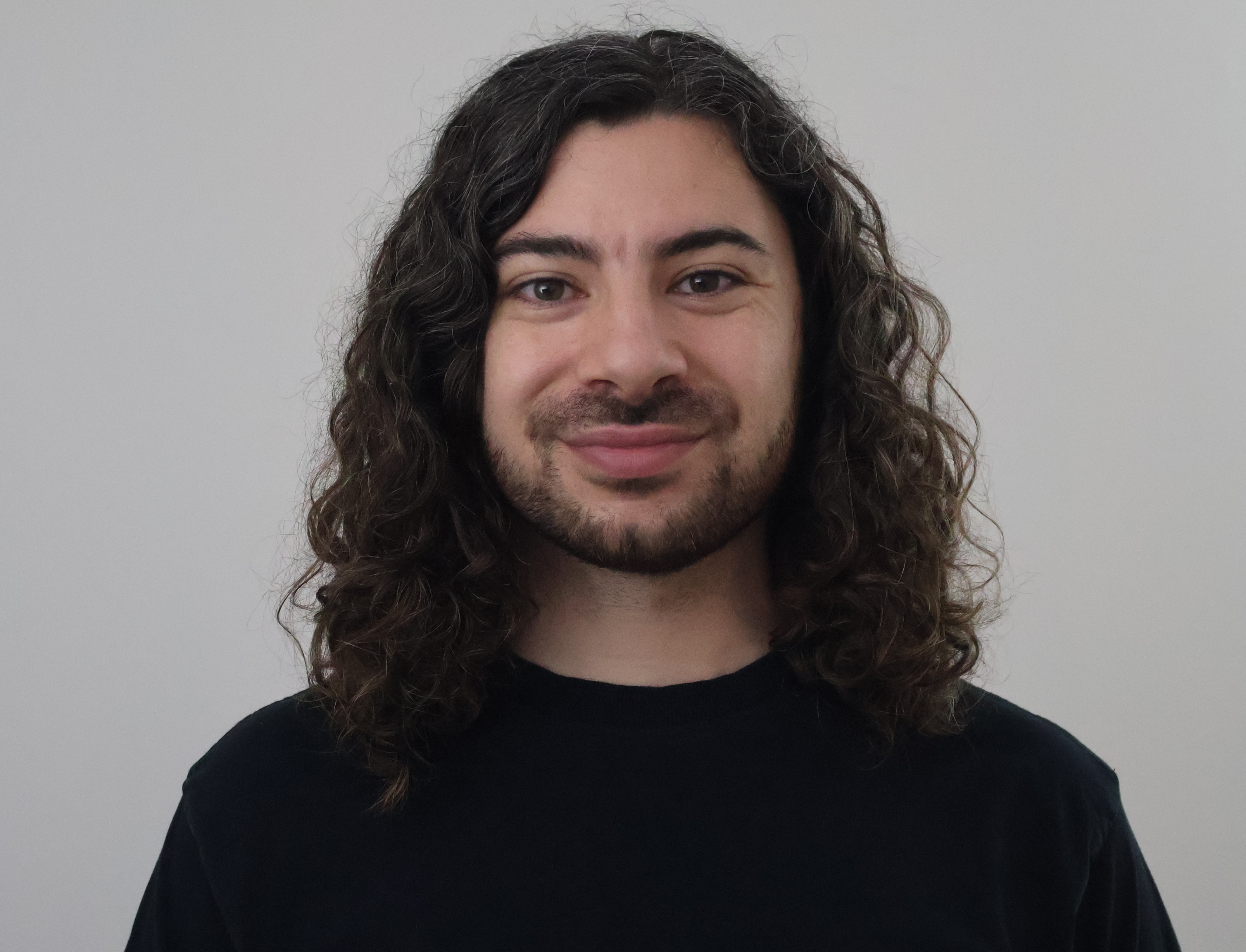 Adam C Younis Headshot Glasses